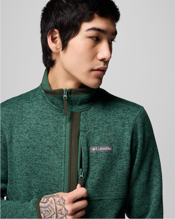 A man wearing a green jacket