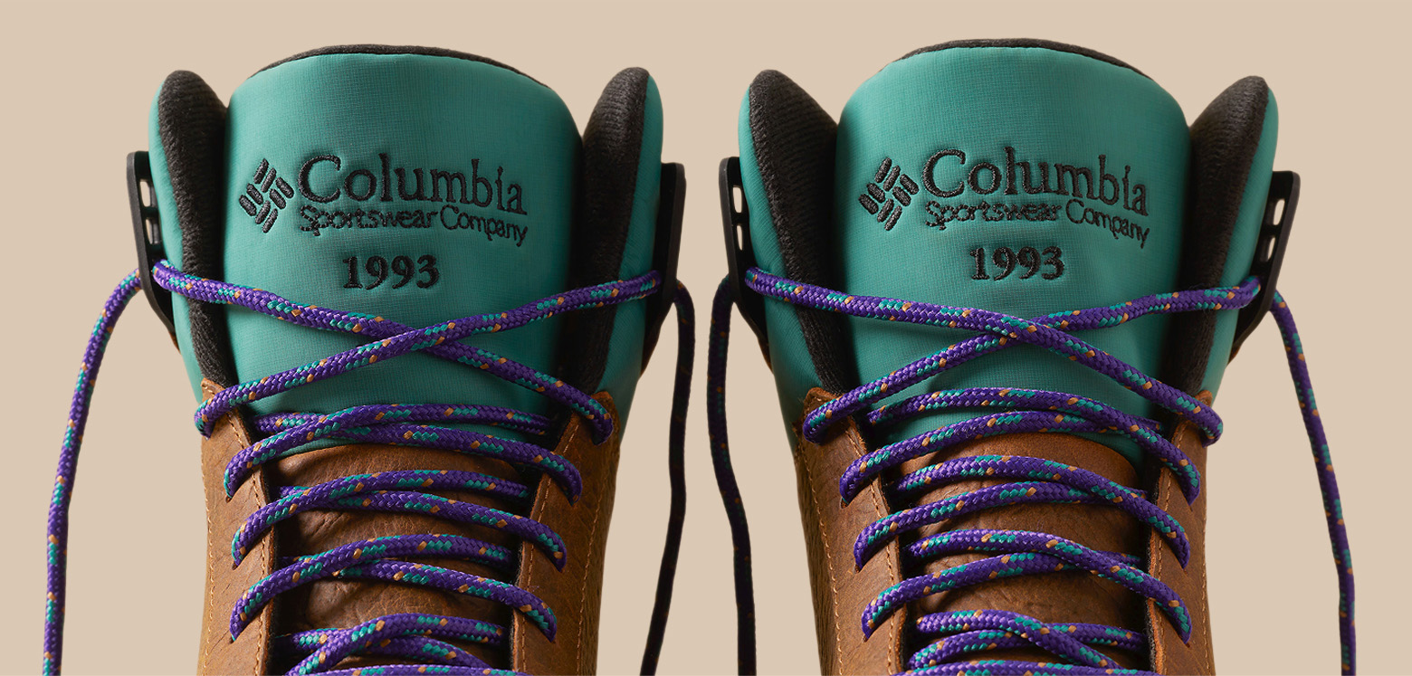Close up of boot tongue with laces and embroidery detail.