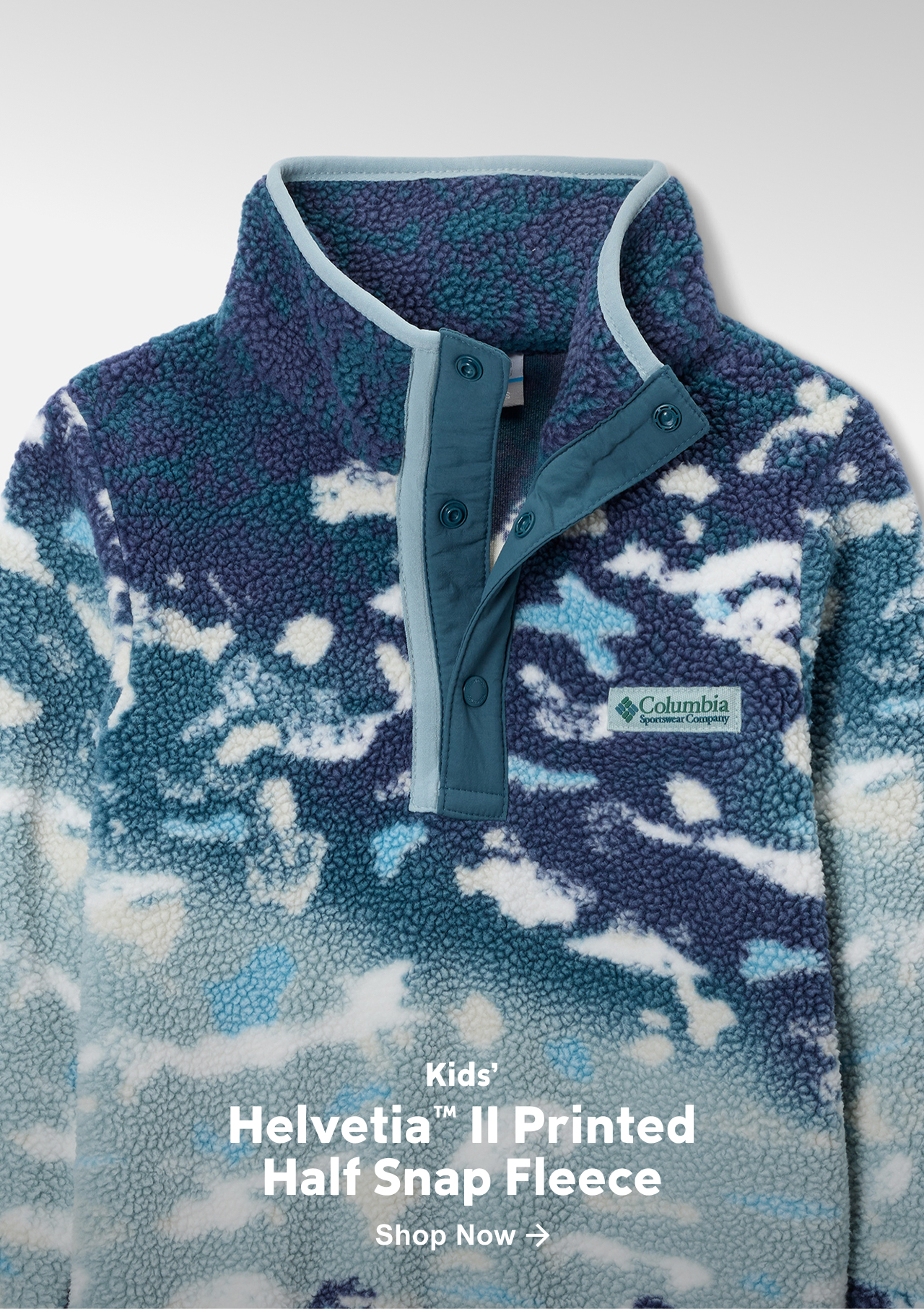 Flatlay of a kids' blue pattern fleece pullover.