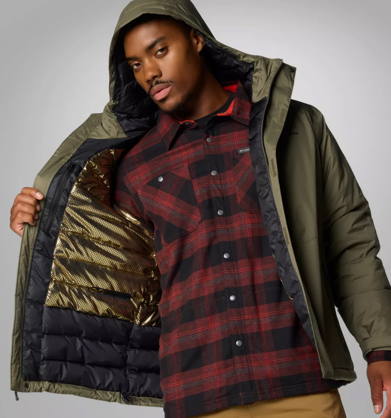 A man wearing a green Omni-Heat™ Infinity Jacket