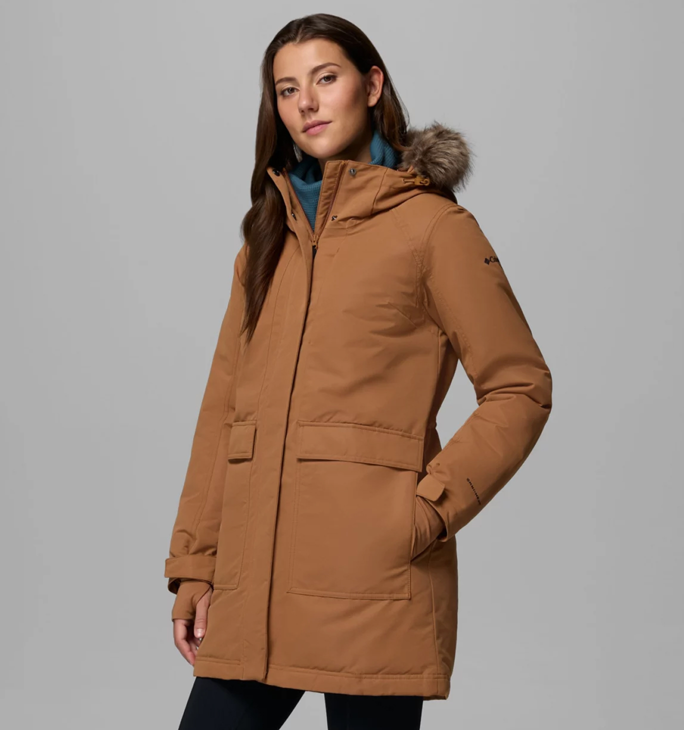 A woman wearing a brown Omni-Heat™ Infinity Jacket