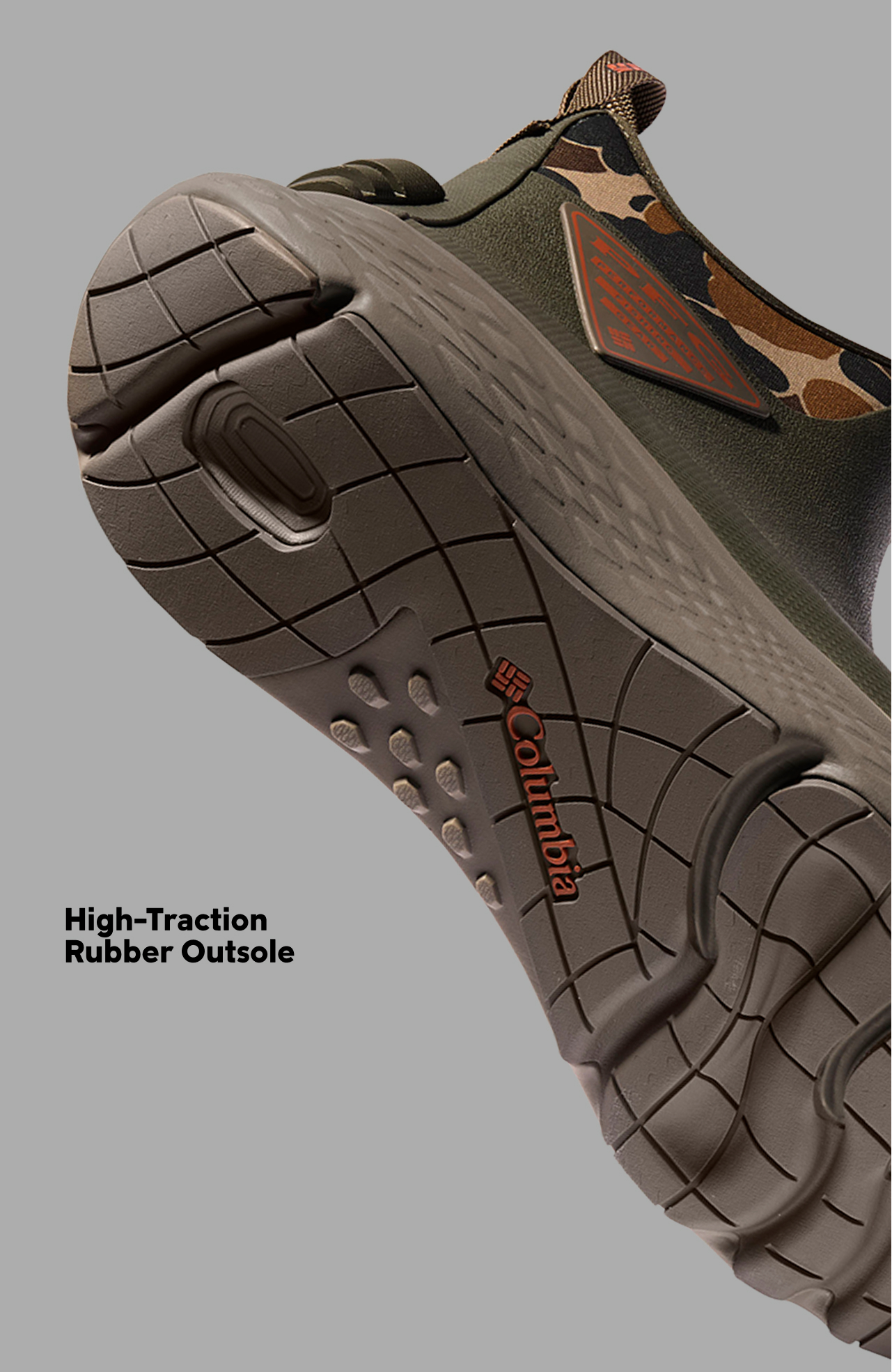 The bottom of a PFG sport boot, showcasing the outsole with text: High-Traction Rubber Outsole