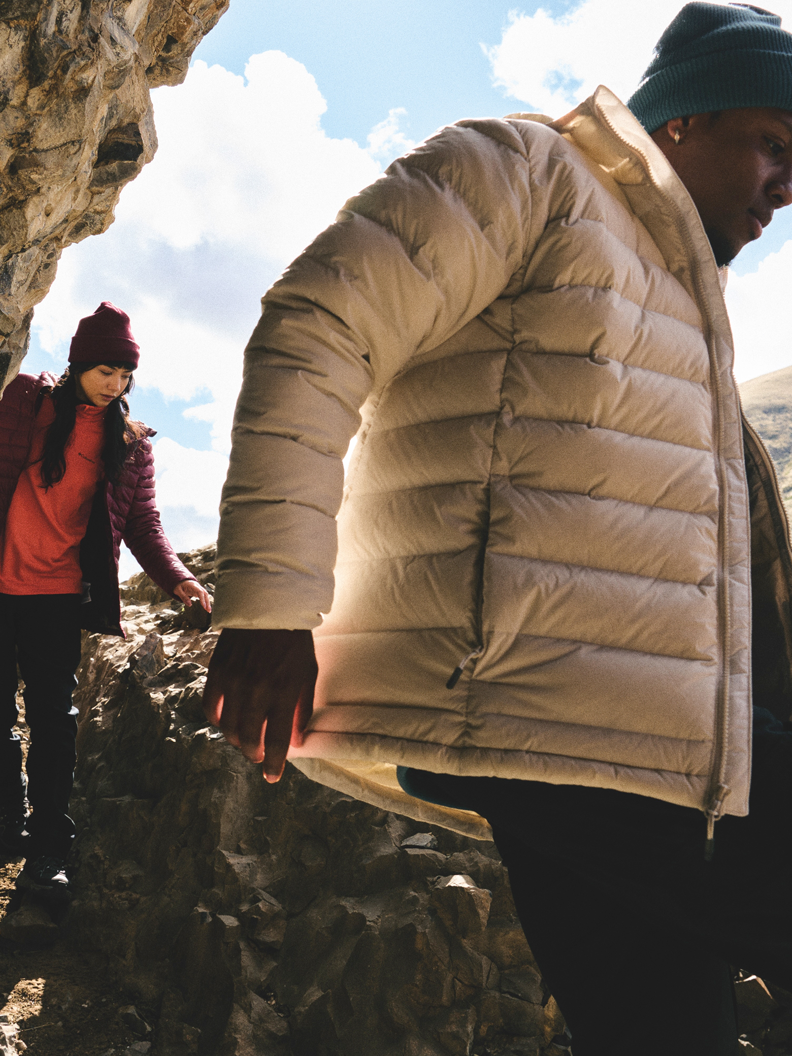 Two hikers navigating a rocky trail.