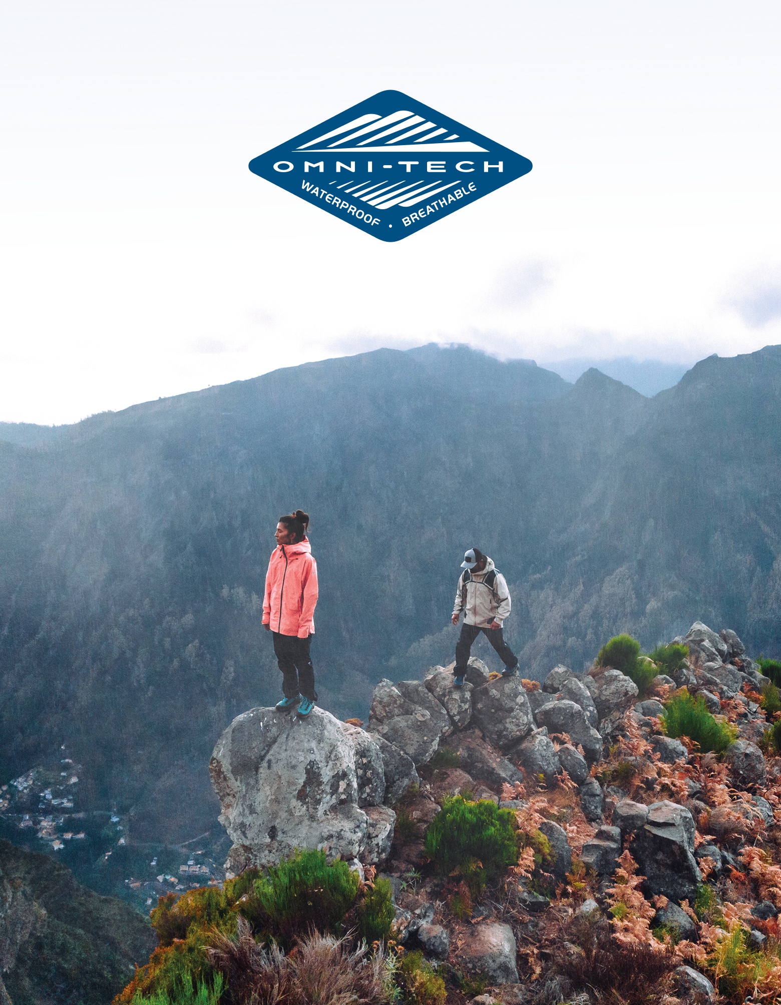 Two people hiking in waterproof gear