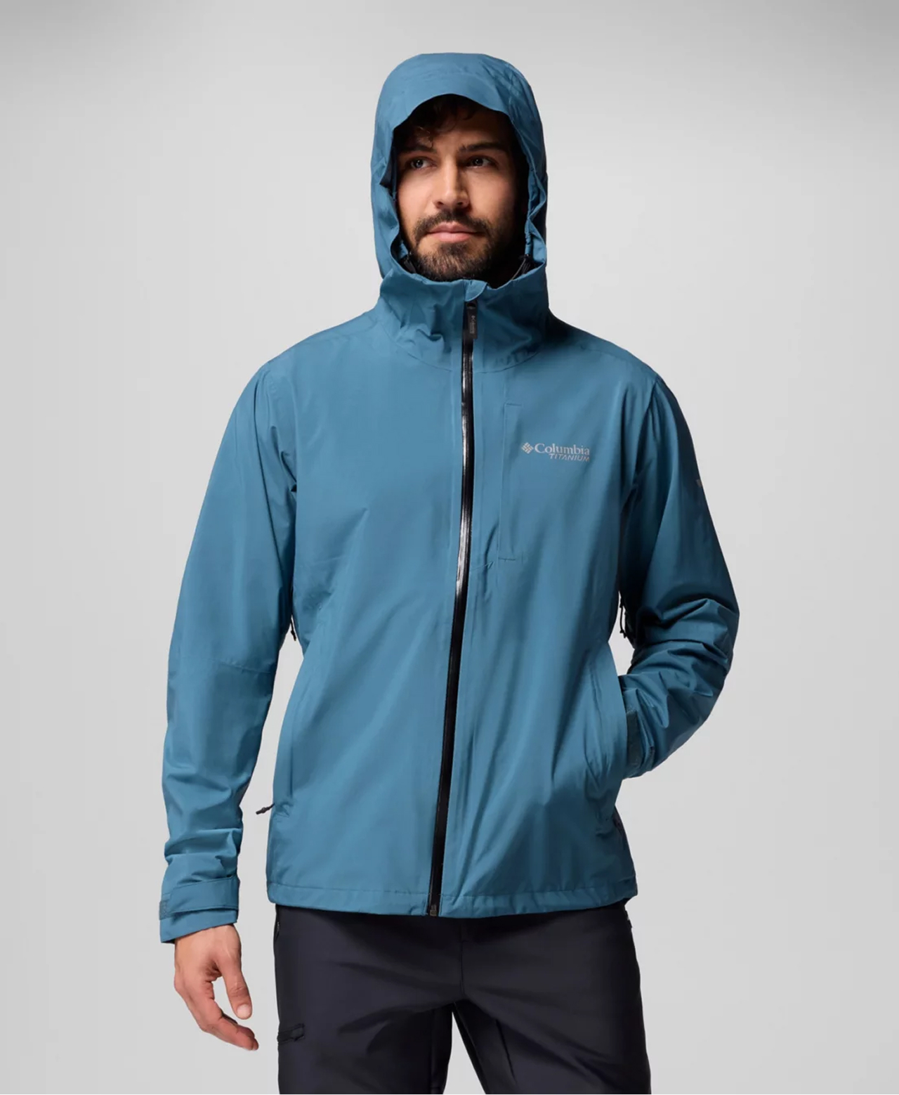 A man wearing a blue rain jacket.