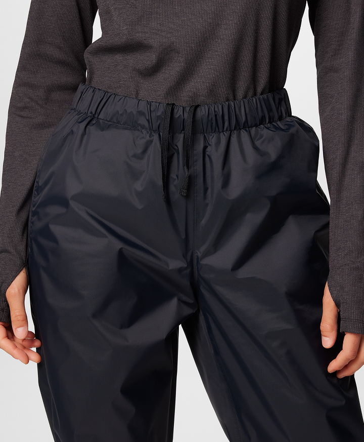A waist down image of black pants.
