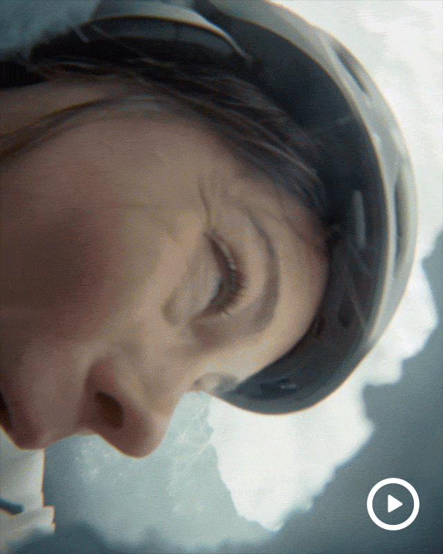 Rotating gif showing a woman being rolled into a giant snowball.