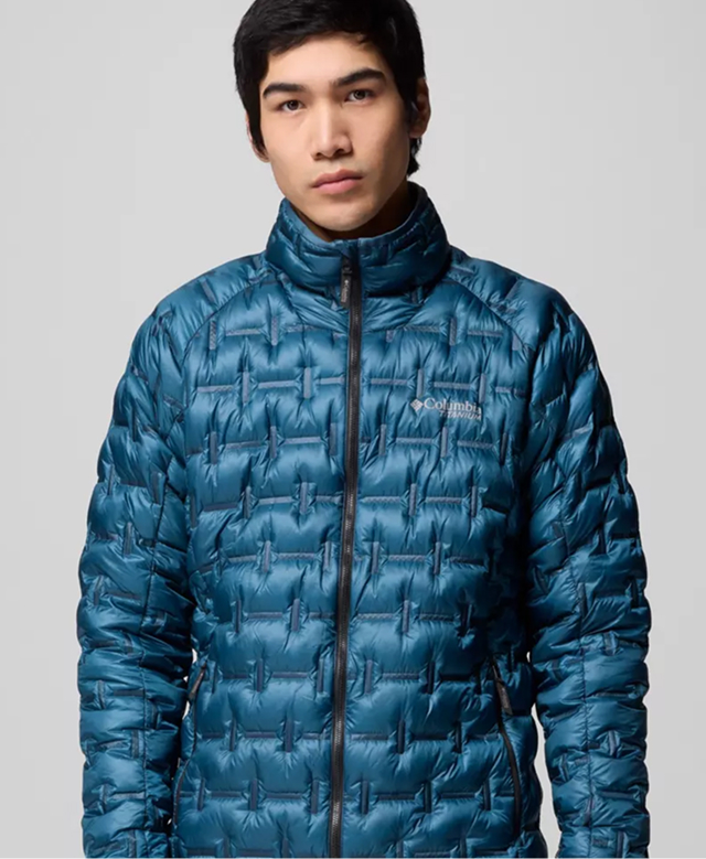 A man wearing a blue puffer jacket.