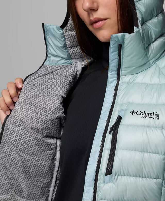 A woman wearing a light blue puffer.