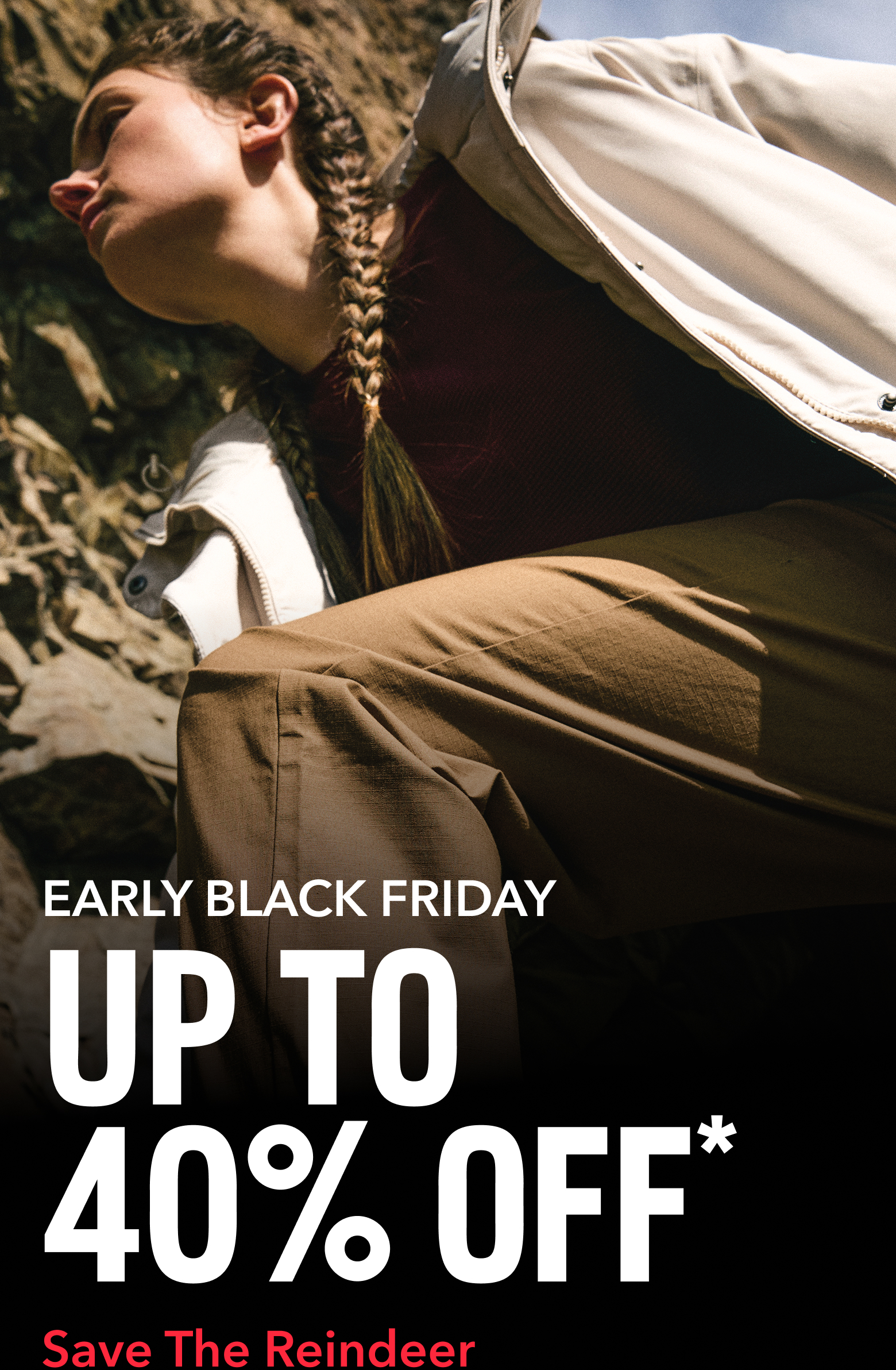 A woman hiking up a rocky landscape with text: EARLY BLACK FRIDAY UP TO 40% OFF*