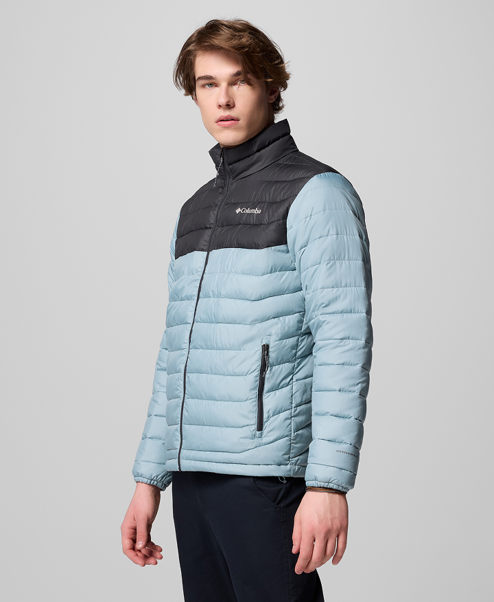 A man wearing a blue puffer jacket.