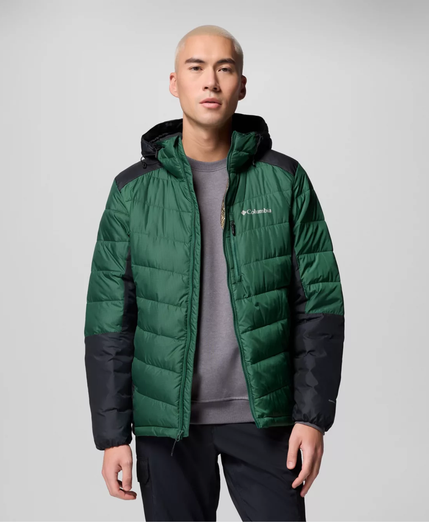 A man wearing a green Omni-Heat™ Infinity Jacket