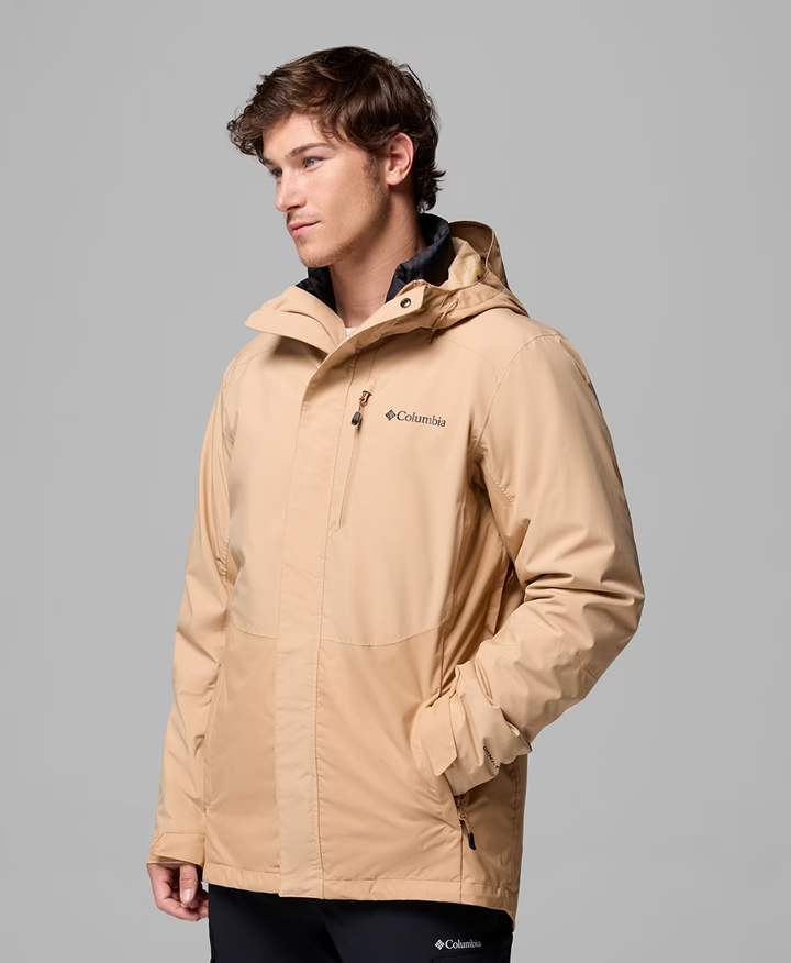 A man wearing a brown jacket.