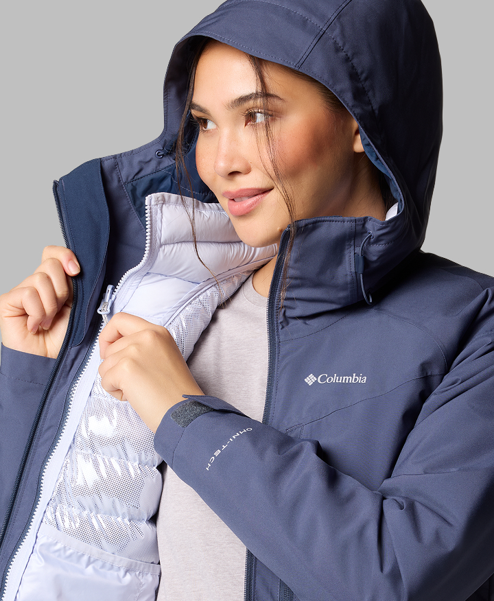 A woman wearing a blue jacket