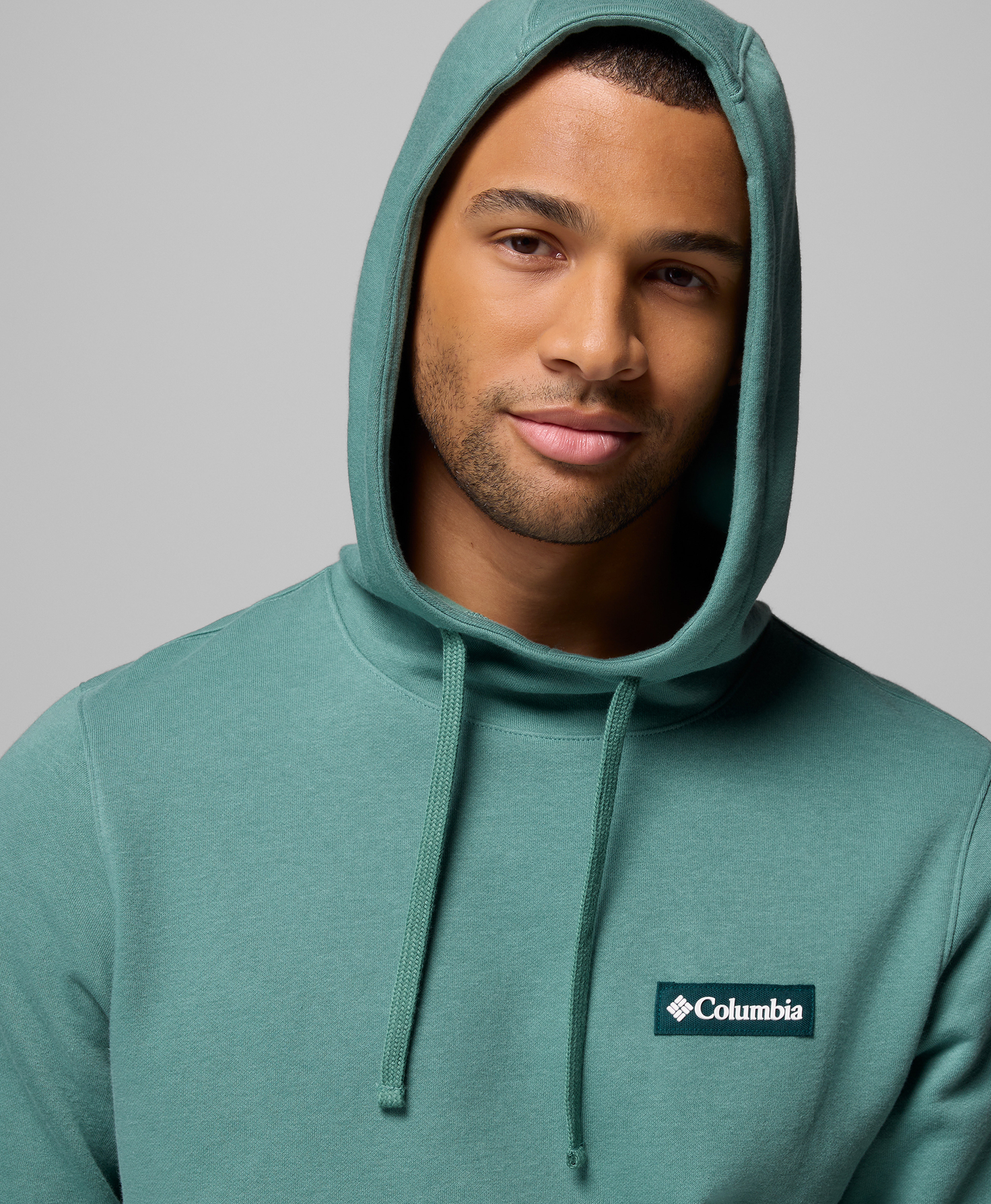 A man wearing a hooded sweatshirt