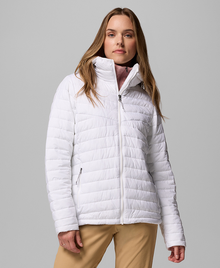 A woman wearing a white puffer jacket