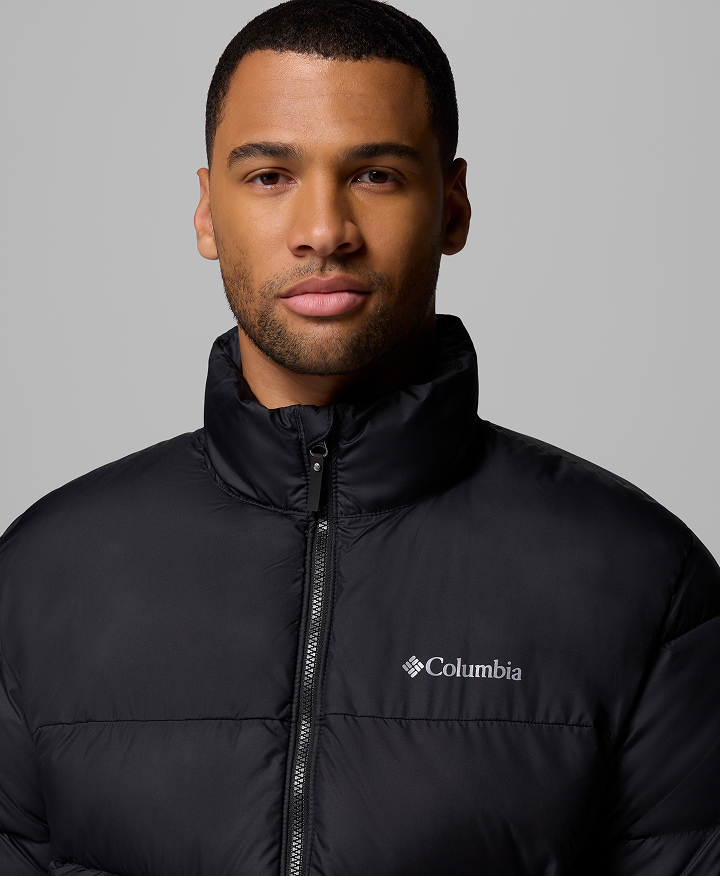 A man wearing a puffer jacket