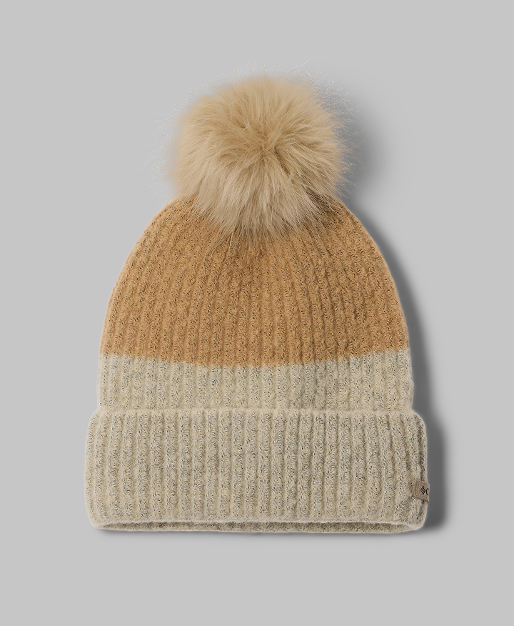 A flat lay of a beanie with pom