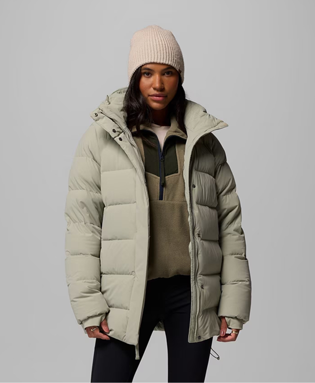 A woman wearing a light green Amaze Puff