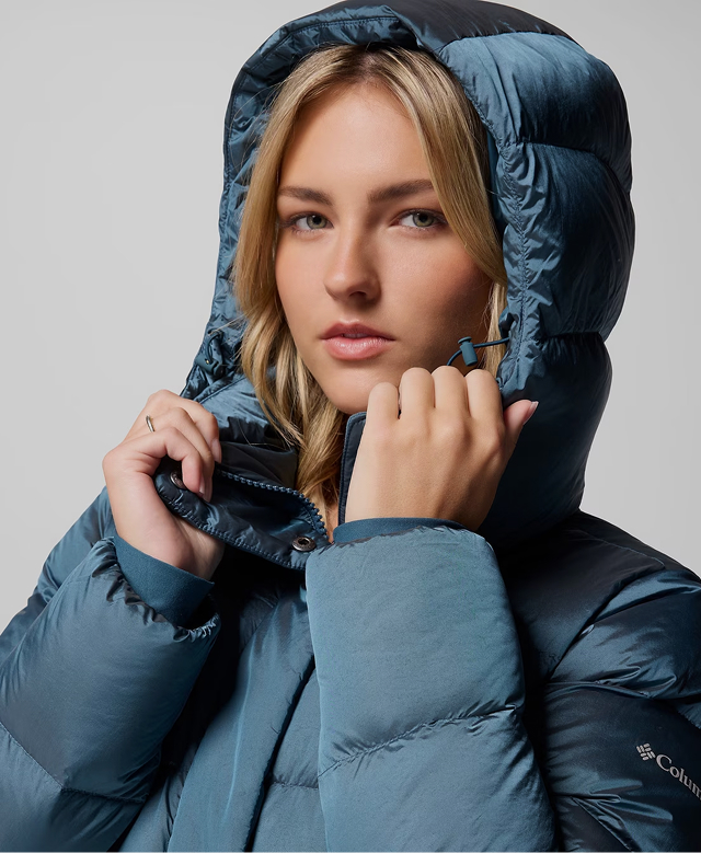 A woman wearing a blue Amaze Puff