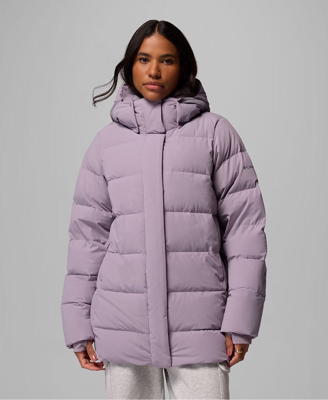 A woman wearing a light purple Amaze Puff
