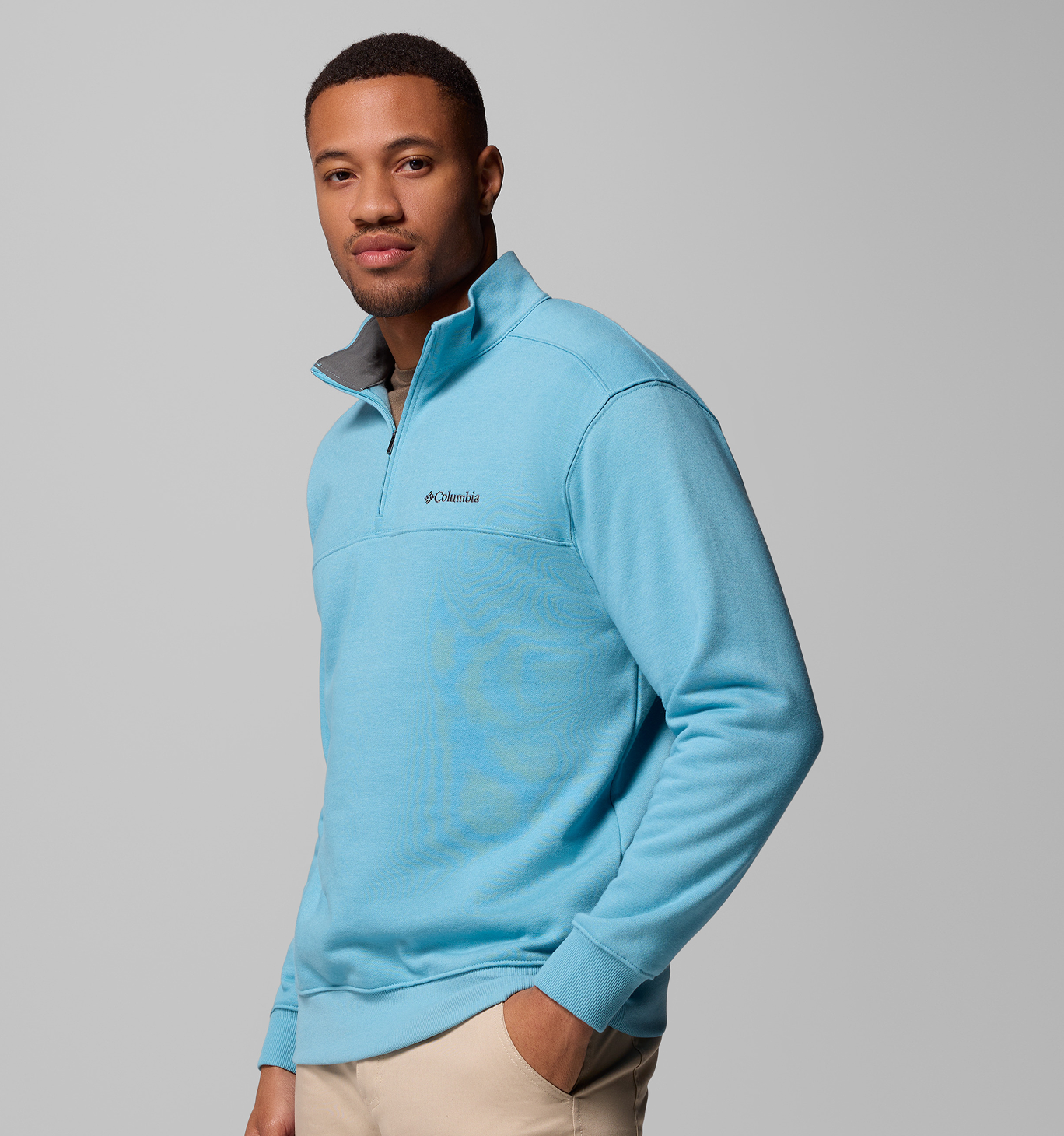 A man wearing a blue sweatshirt