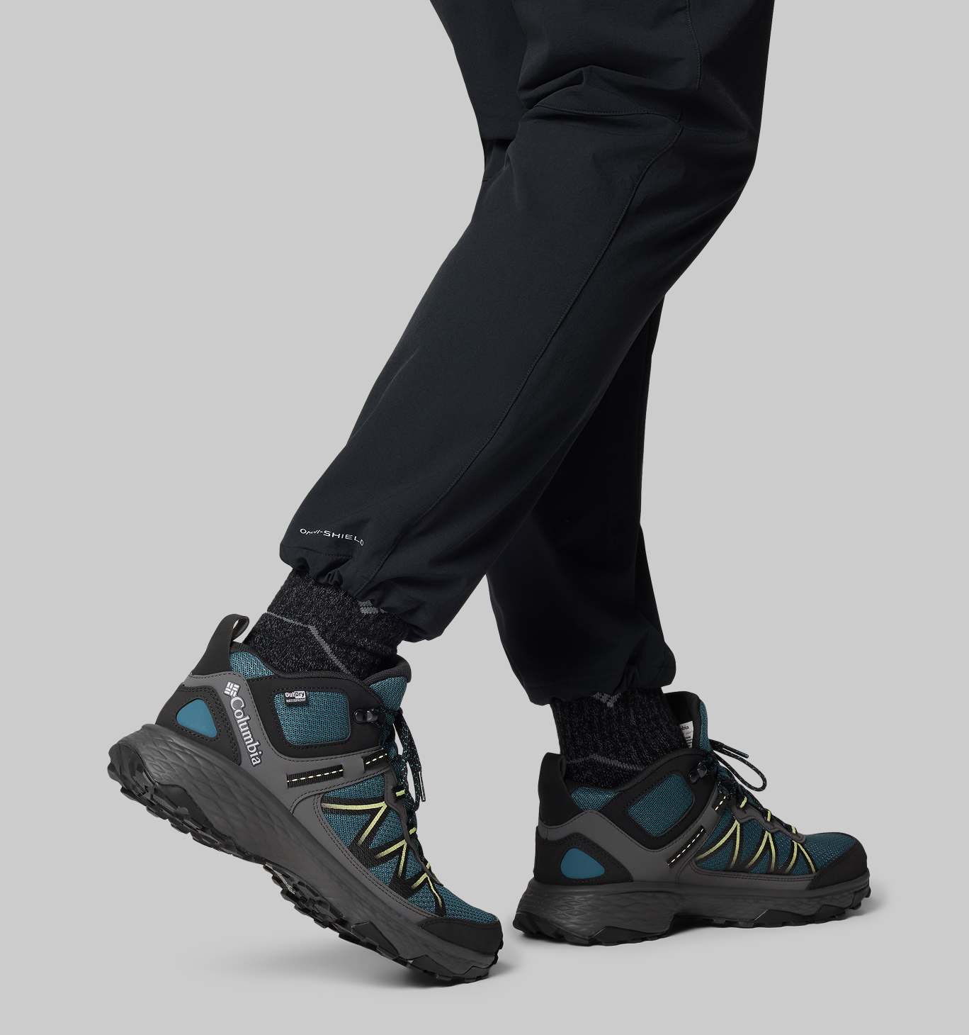 A man wearing a black and blue boots