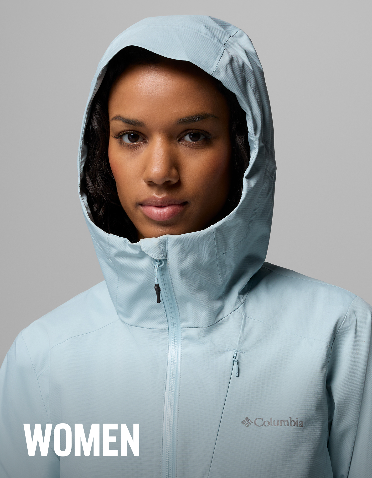 A woman wearing a light blue rain jacket with text overlay 