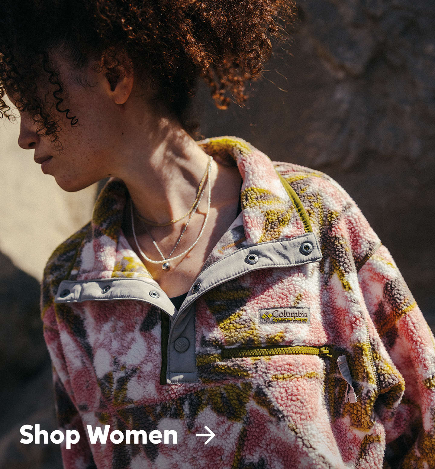 Woman wearing pink and green Helvetia Fleece
