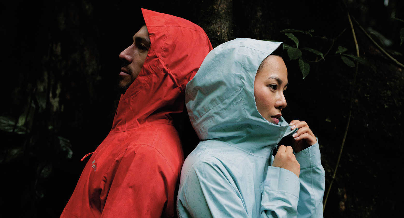 A man and a woman each in a rain jacket.