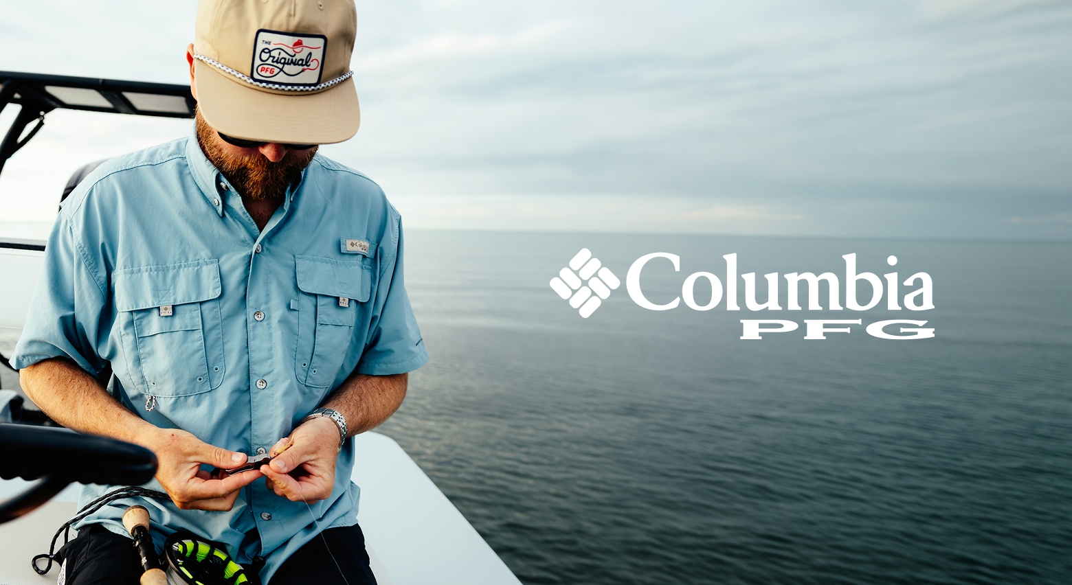 A man in a light blue Bahama shirt on a boat