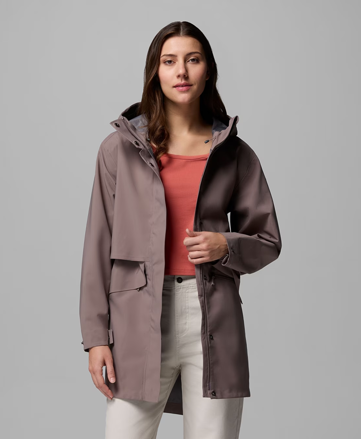 A woman wearing a mauve jacket.