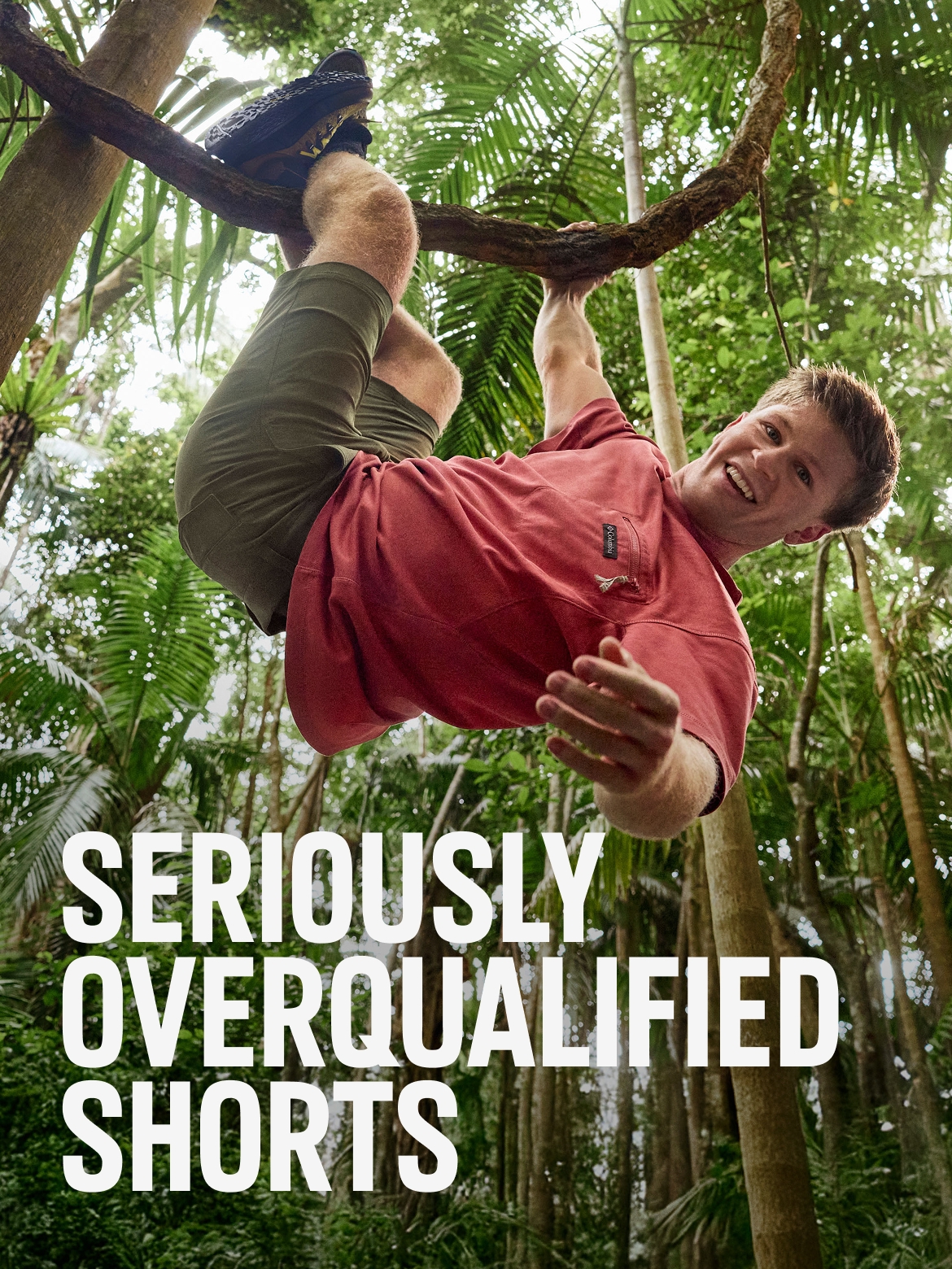 Man in neutral ROC shorts hanging from a tree. SERIOUSLY OVERQUALIFIED SHORTS