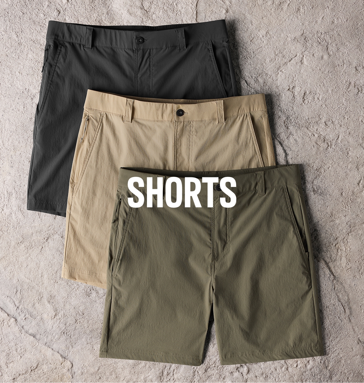Three ROC shorts laid on top of a rock texted background