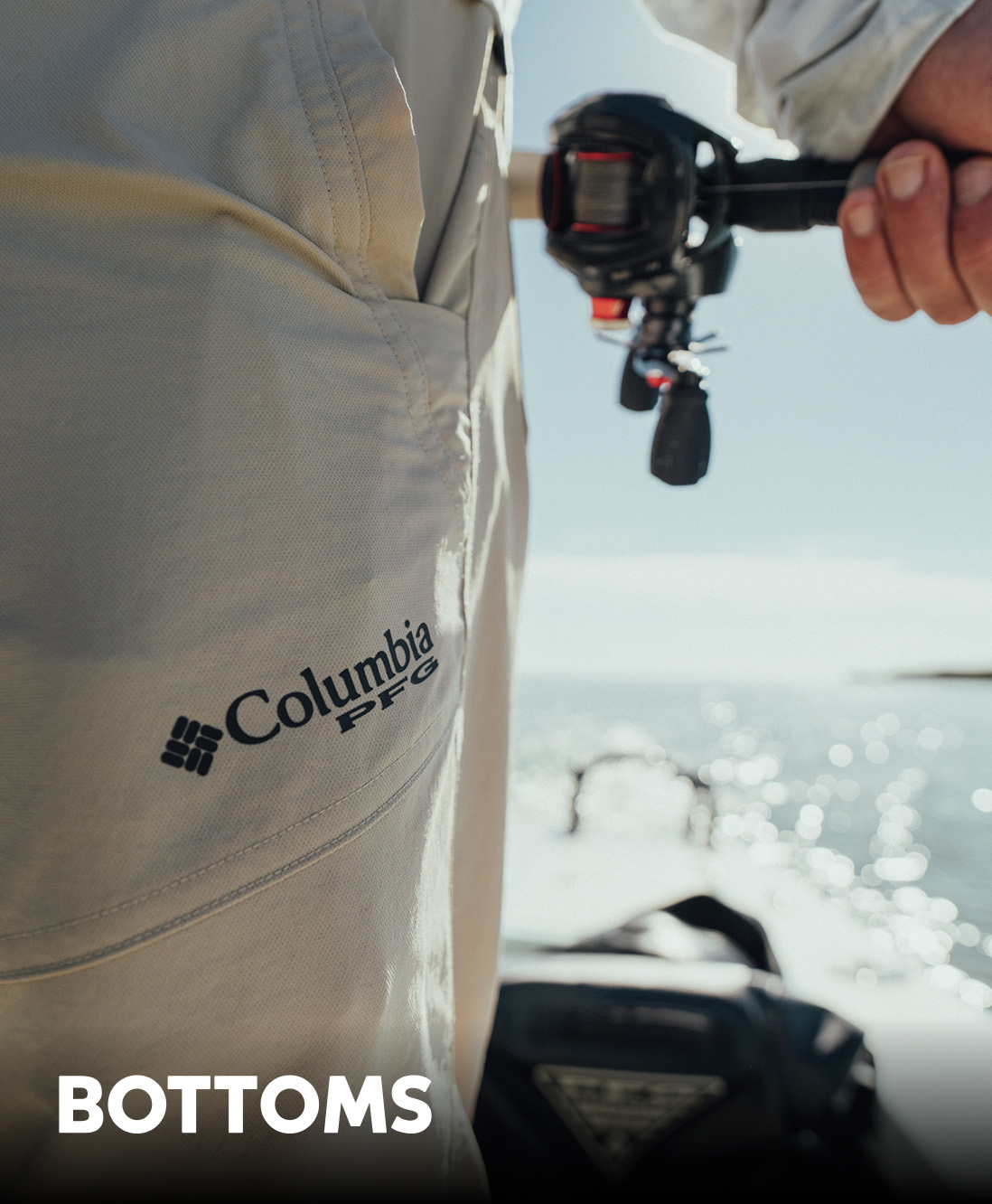 Close-up of an angler's pair of pants featuring the Columbia PFG logo, on a boat with text: BOTTOMS