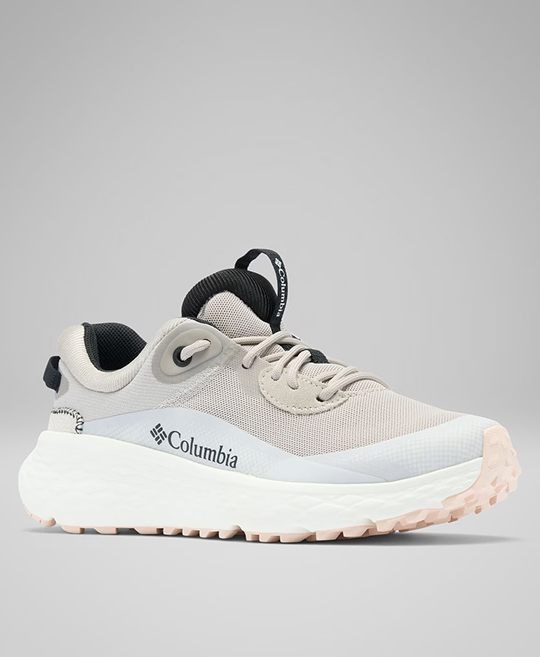 A white and tan women's hiking shoe.