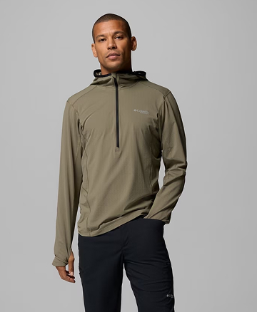 A man wearing a green hoodie.