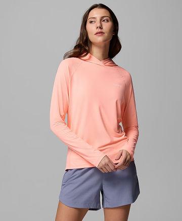 A woman wearing a pink sun hoodie.