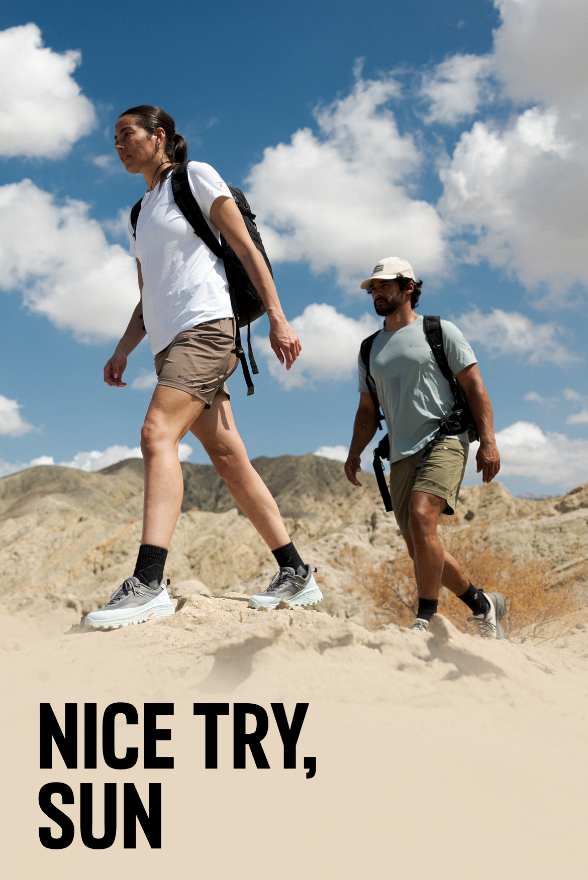 Headline reads: Nice try, sun. Image is of a woman and a man backpacking through desert hills on a sunny day. 