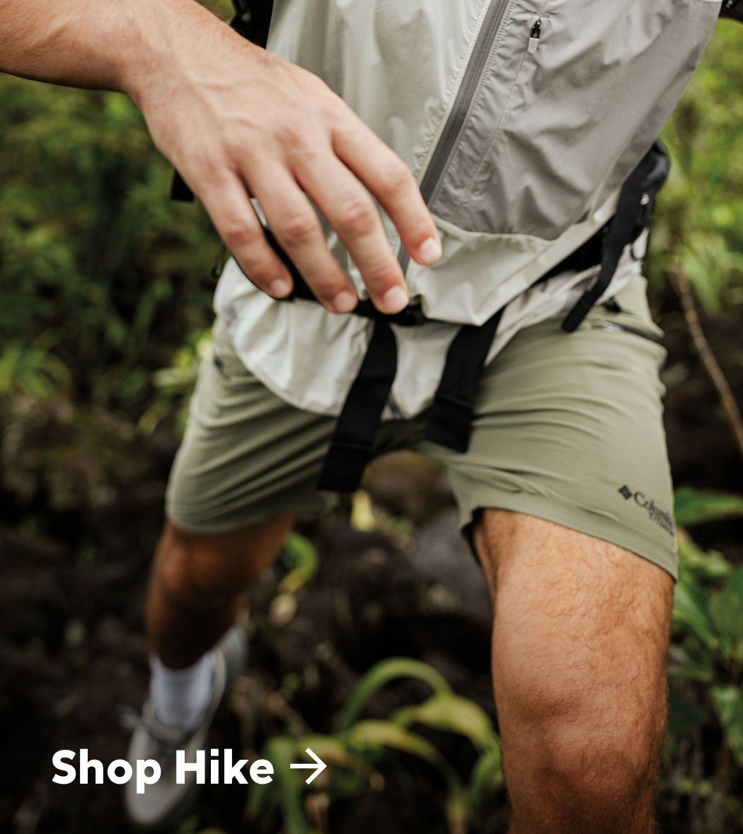 Shop Hike over a waist down image of a person hiking with a focus on the shorts