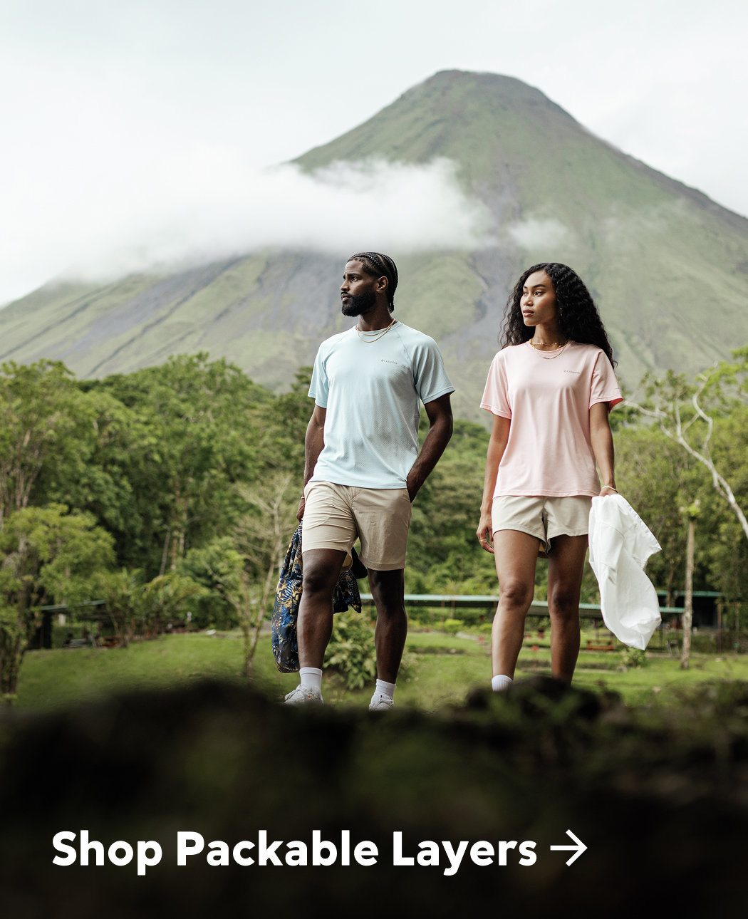 Two hikers with a mountain the background