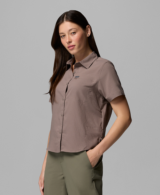 A woman wearing a button-up shirt