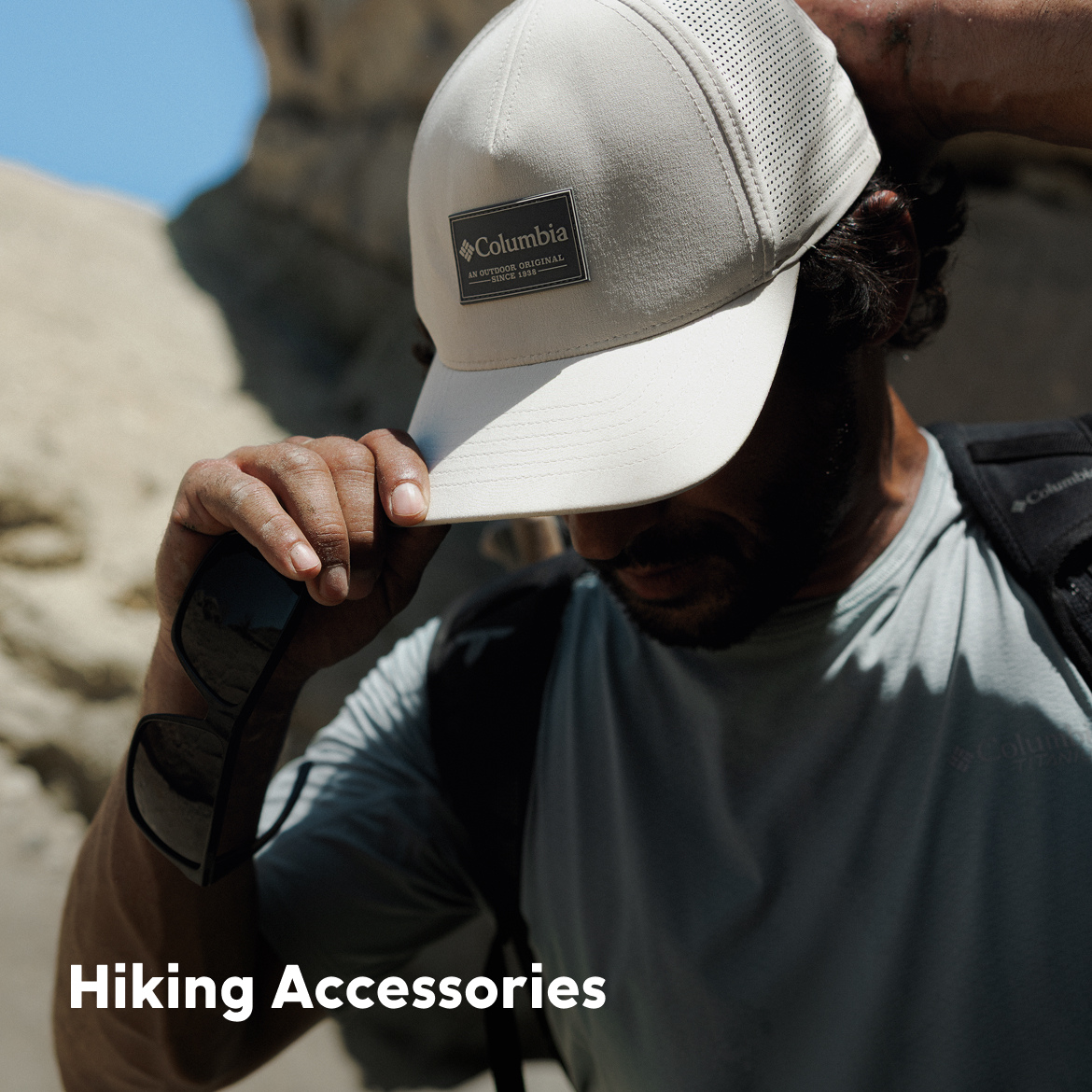 Hiking Accessories over a man wearing a hat