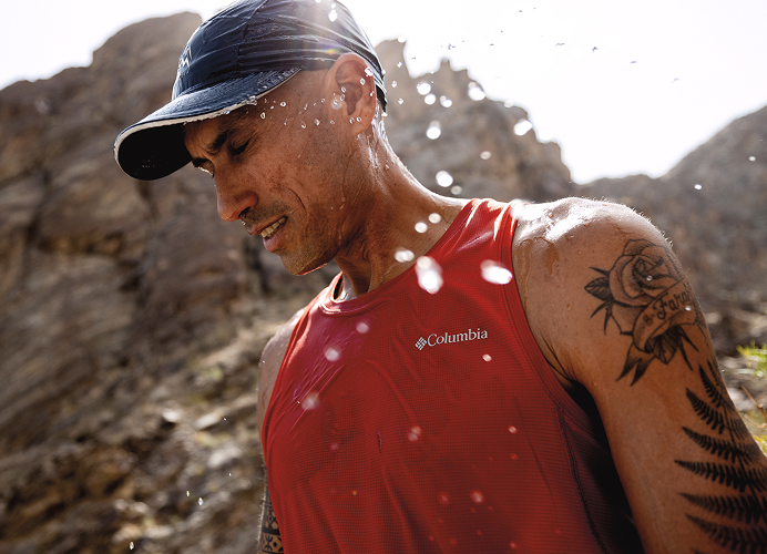 Close up of someone walking with rocky terrain background