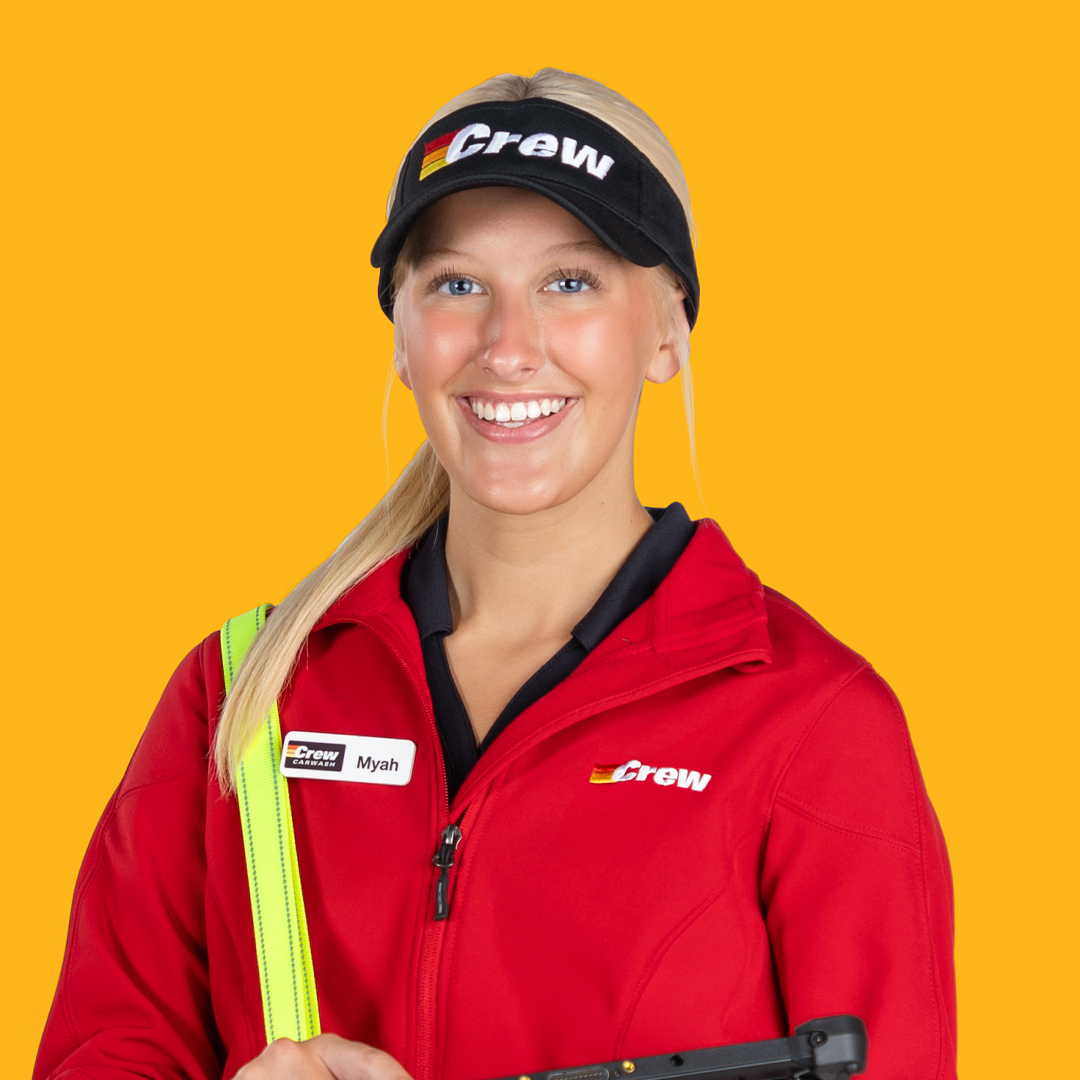 A Smiling Crew Carwash Team Member