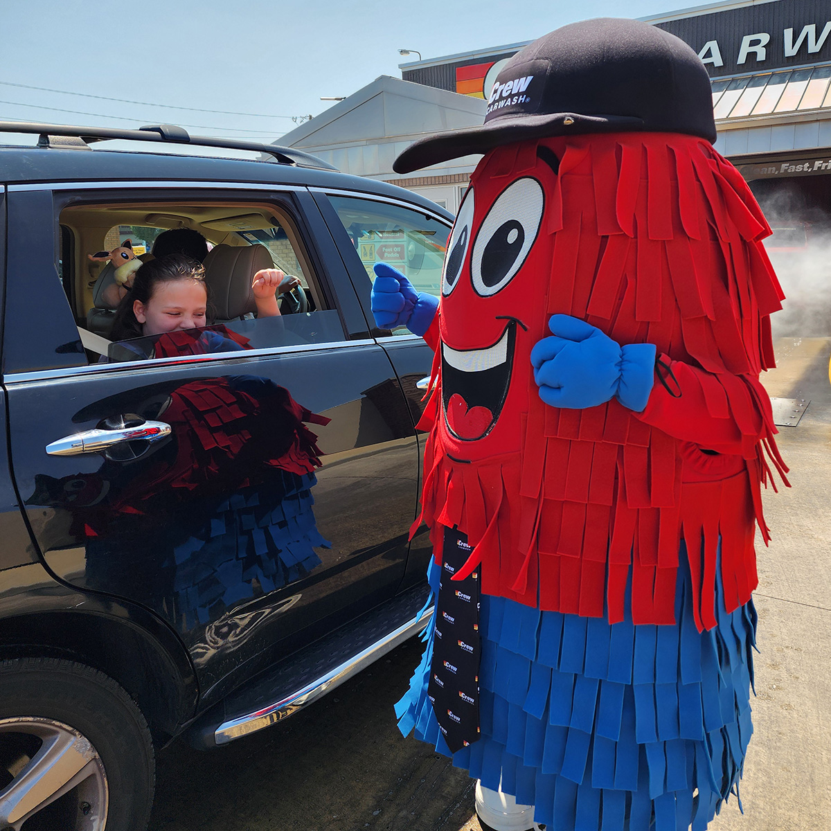 Spinner greeting a wash customer