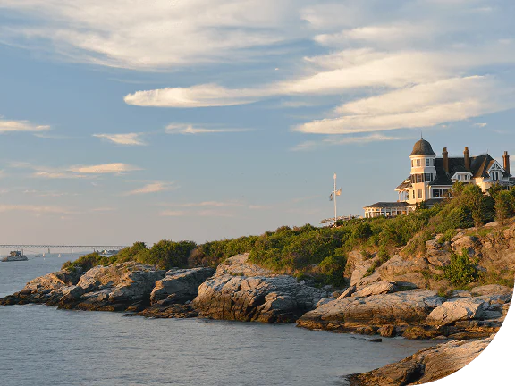 Lighthouse on rocky coast of Newport, Rhode Island.