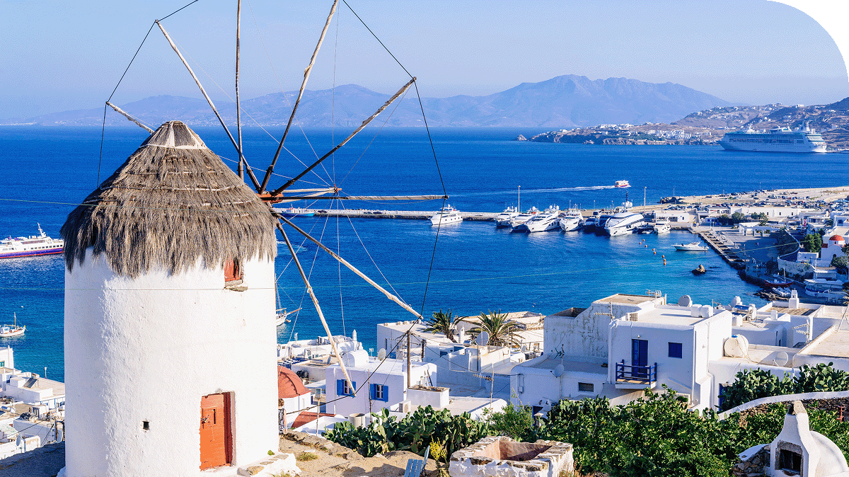 Windmills above Cyclades, Greece