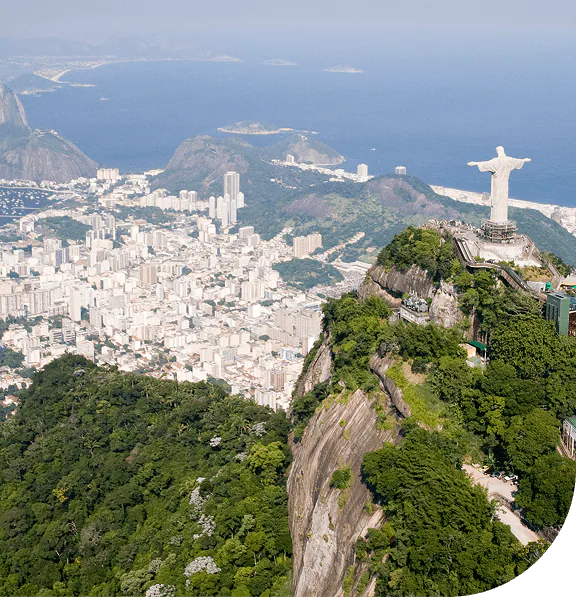 Aerial view of Rio de Janeiro with Christ the Redeemer in the foreground.