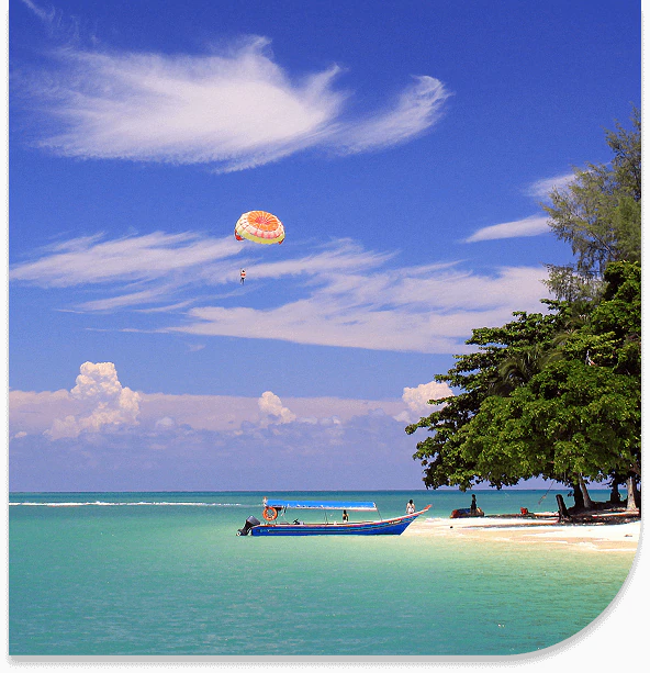 Parasailing along the beautiful beaches of Langkawi, Malaysia.